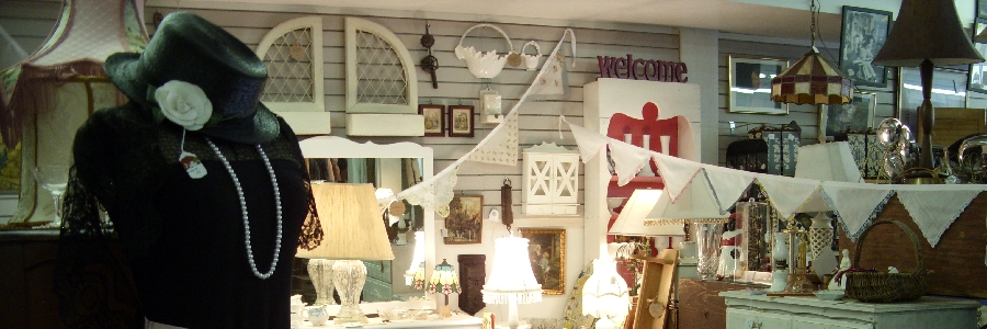 parlor lamps, electric lanterns, and oil lanterns lit with red indian silk with gold borders in the background